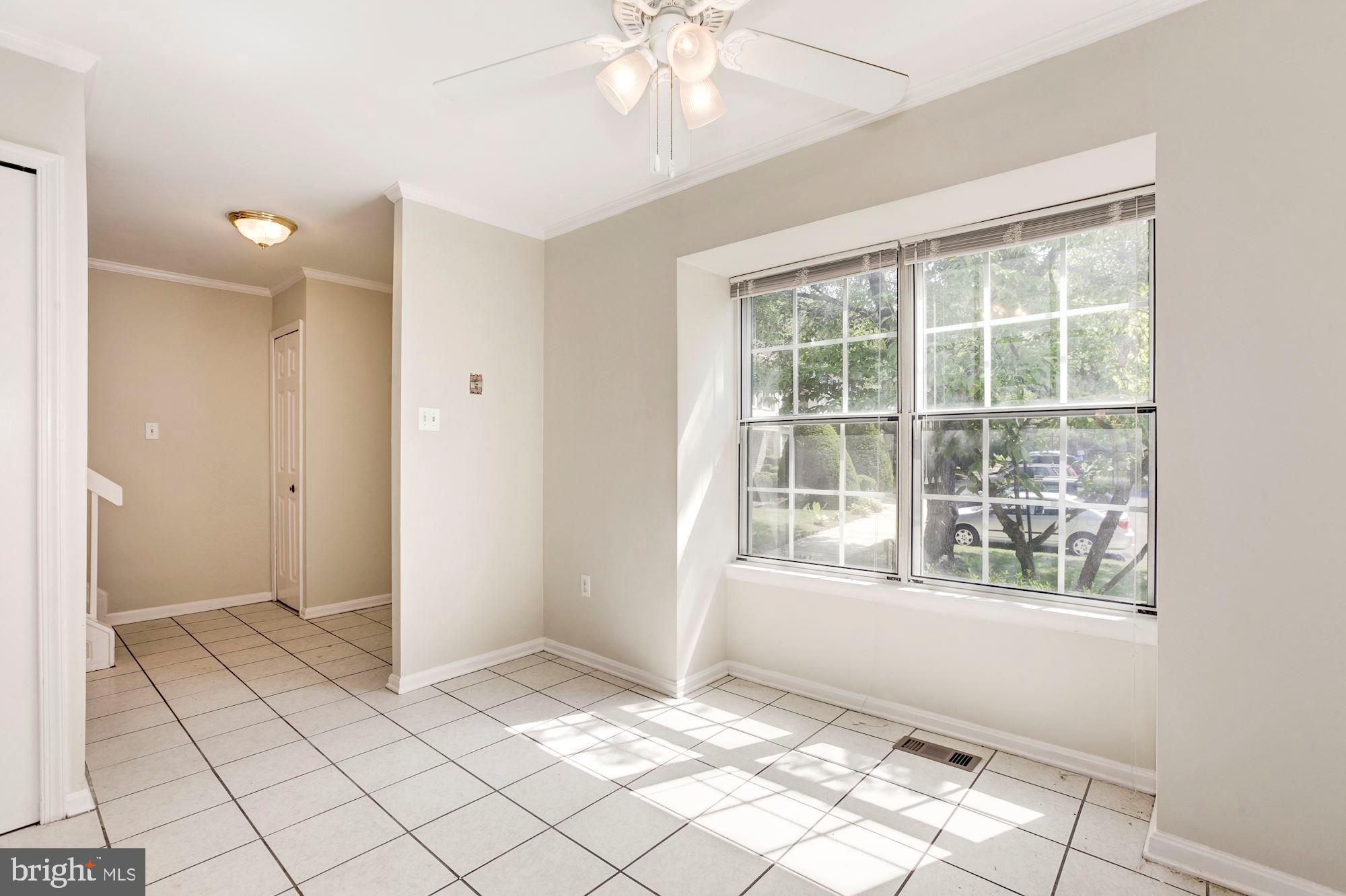 14518 MacBeth Drive Silver Spring, MD 20906 - Photo 7 of 43 a view of an empty room with window and chandelier fan
