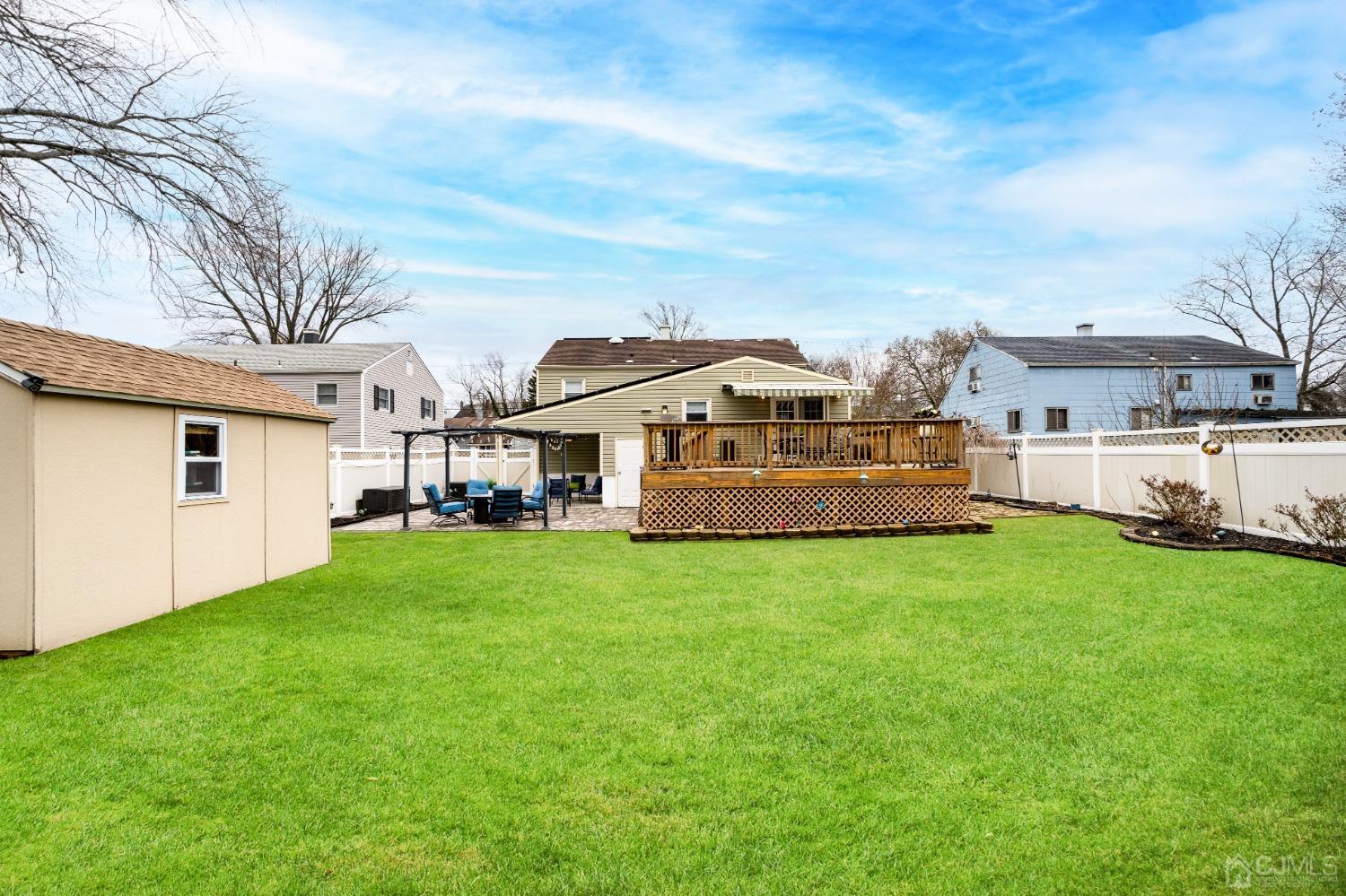241 McFarlane Road Colonia, NJ 07067 - Photo 54 of 60 a aerial view of a house with table and chairs