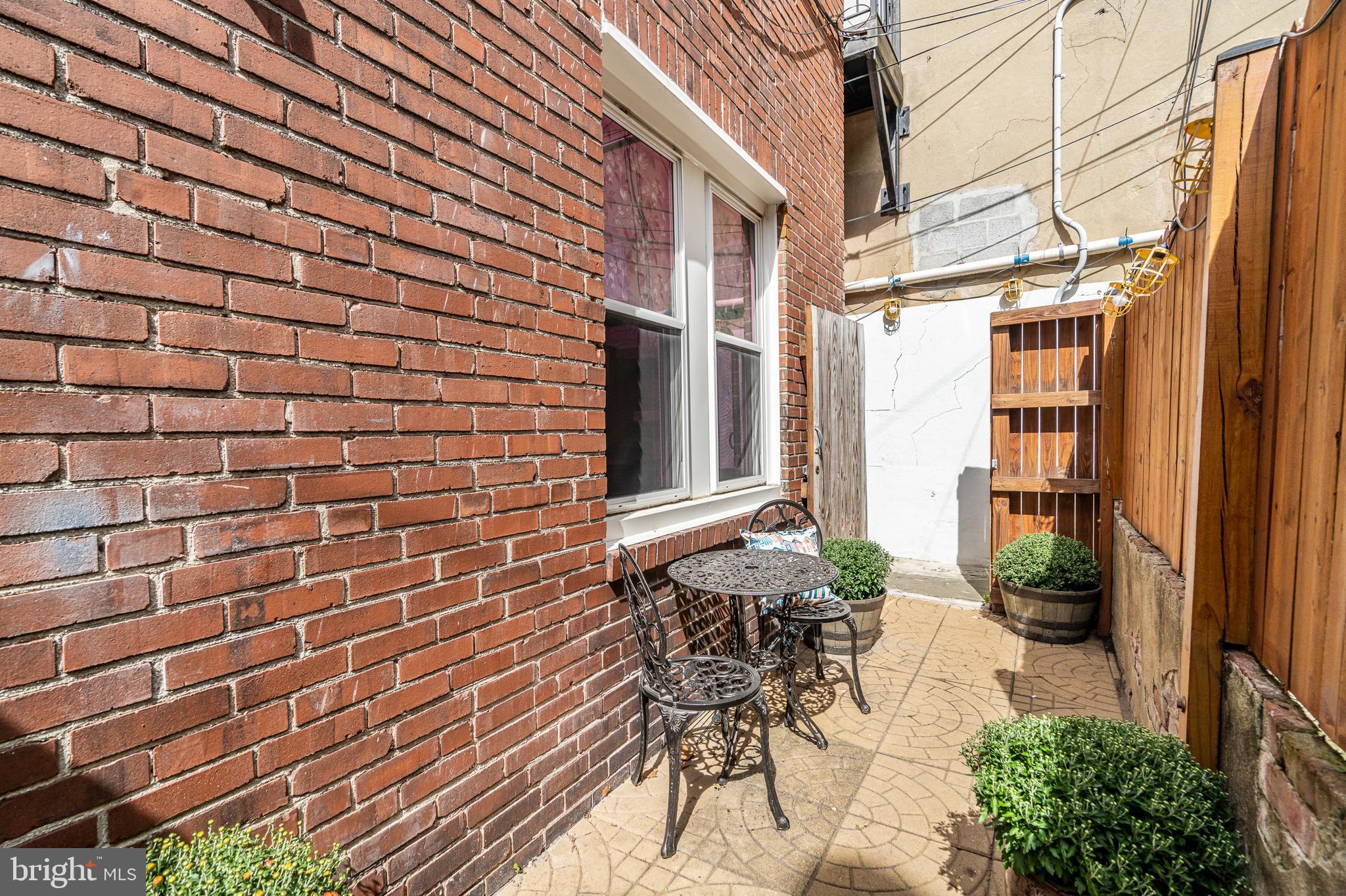 4339 Main Street, Unit R Philadelphia, PA 19127 - Photo 12 of 14 a view of patio with table and chairs and potted plants