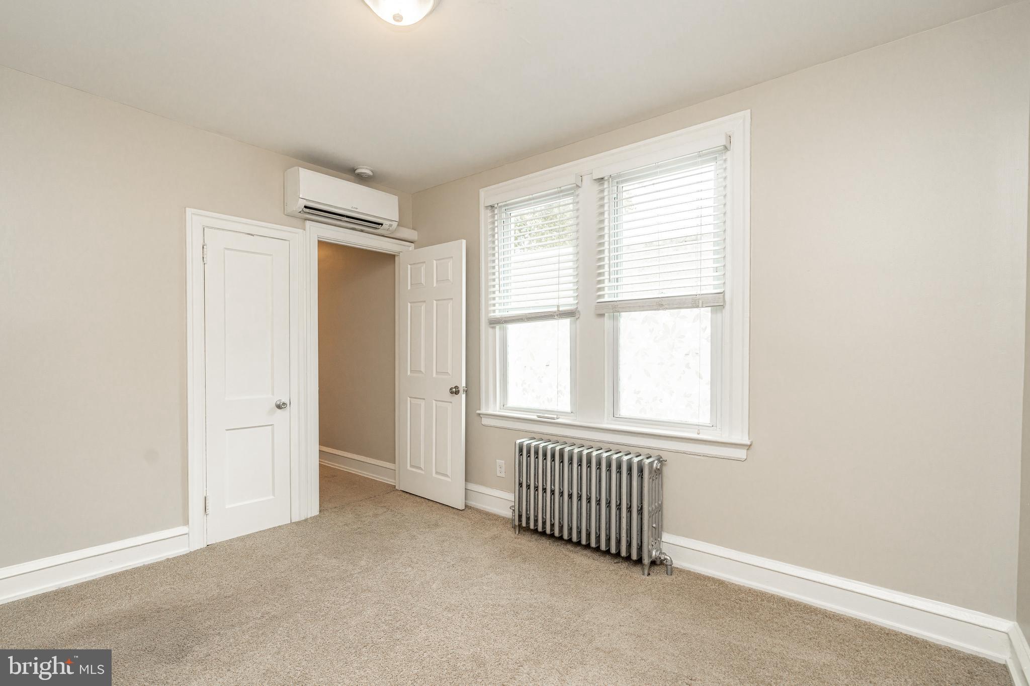 4339 Main Street, Unit R Philadelphia, PA 19127 - Photo 6 of 14 an empty room with windows