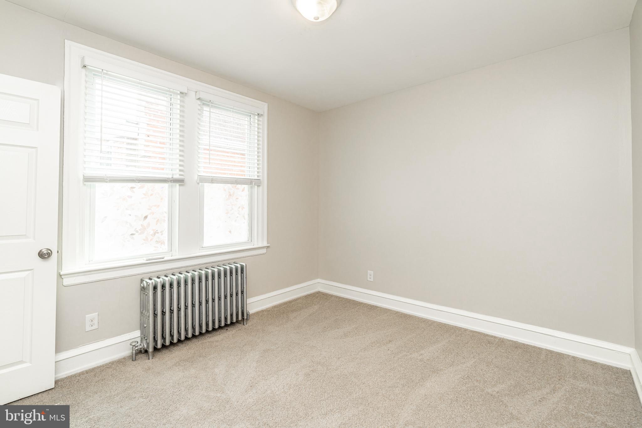 4339 Main Street, Unit R Philadelphia, PA 19127 - Photo 10 of 14 an empty room with a window