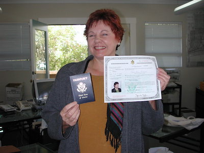 a woman holding a card with a picture of a woman on it