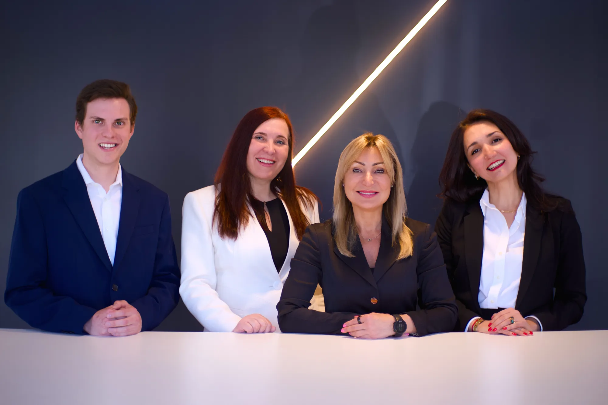 natalia and team in black background with light