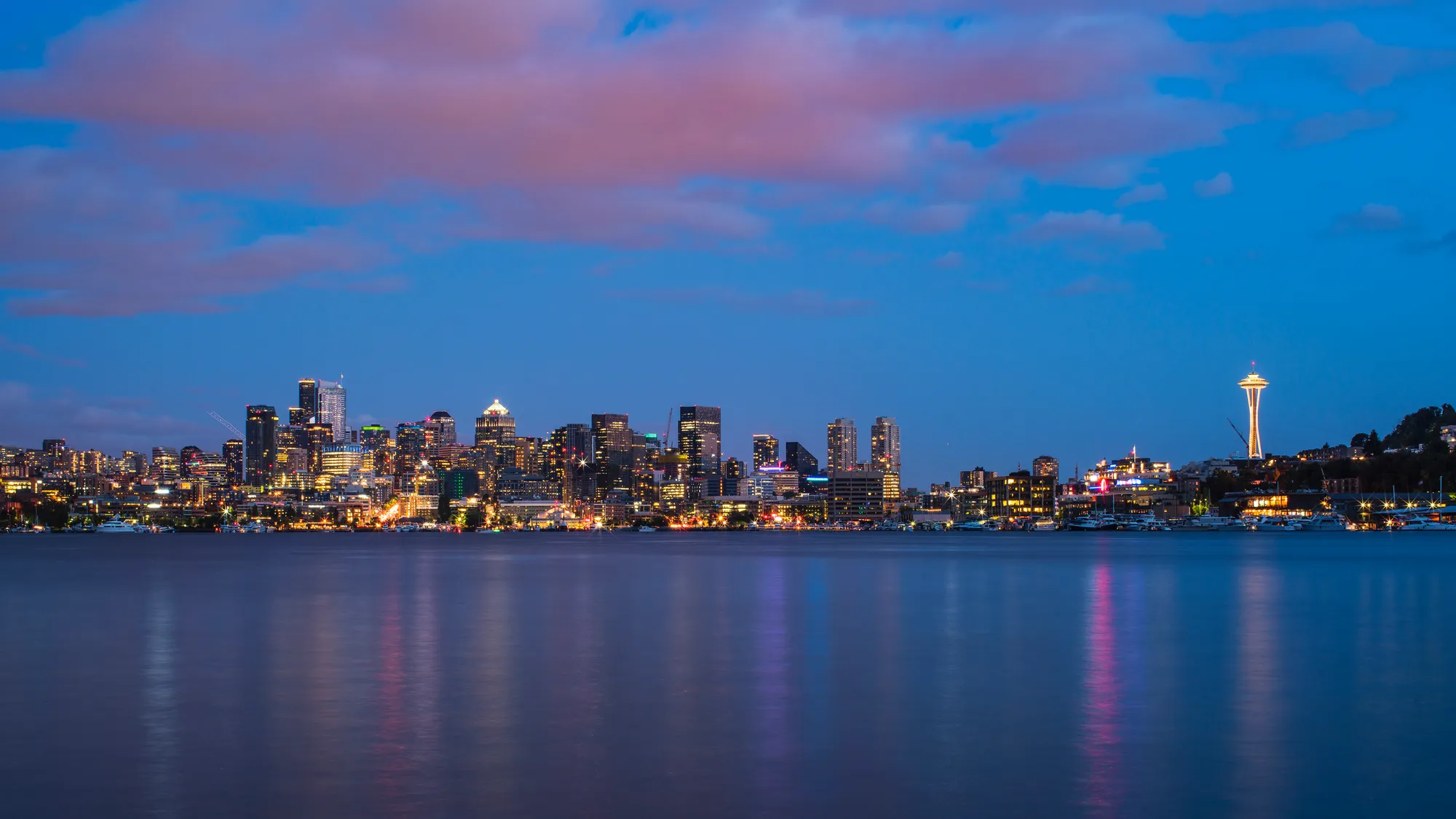 A city at night with a large body of water
