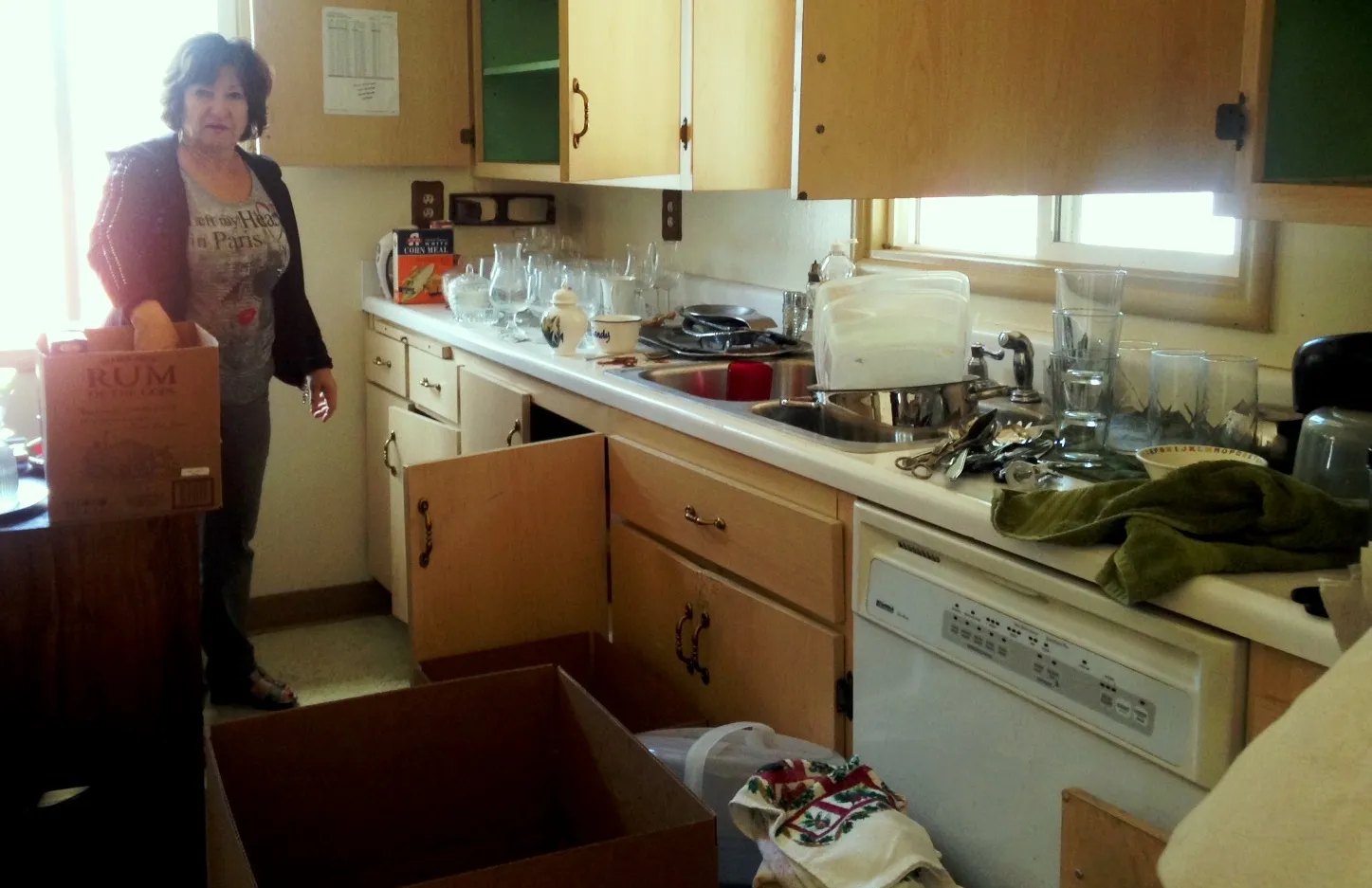 Wayka Bartolacelli packing away donations for a client; listing prep-work; behind the scenes at our listings; hands-on realtor; Casa Bartolacelli; Marin County Real Estate Agent