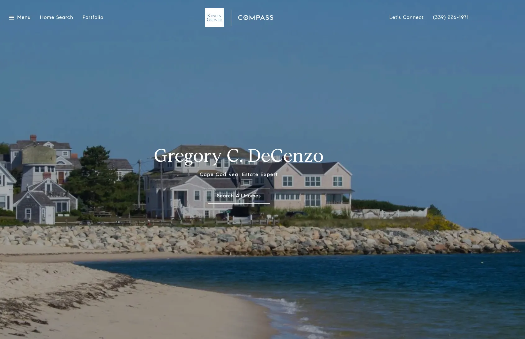 A beach with a house and a boat.