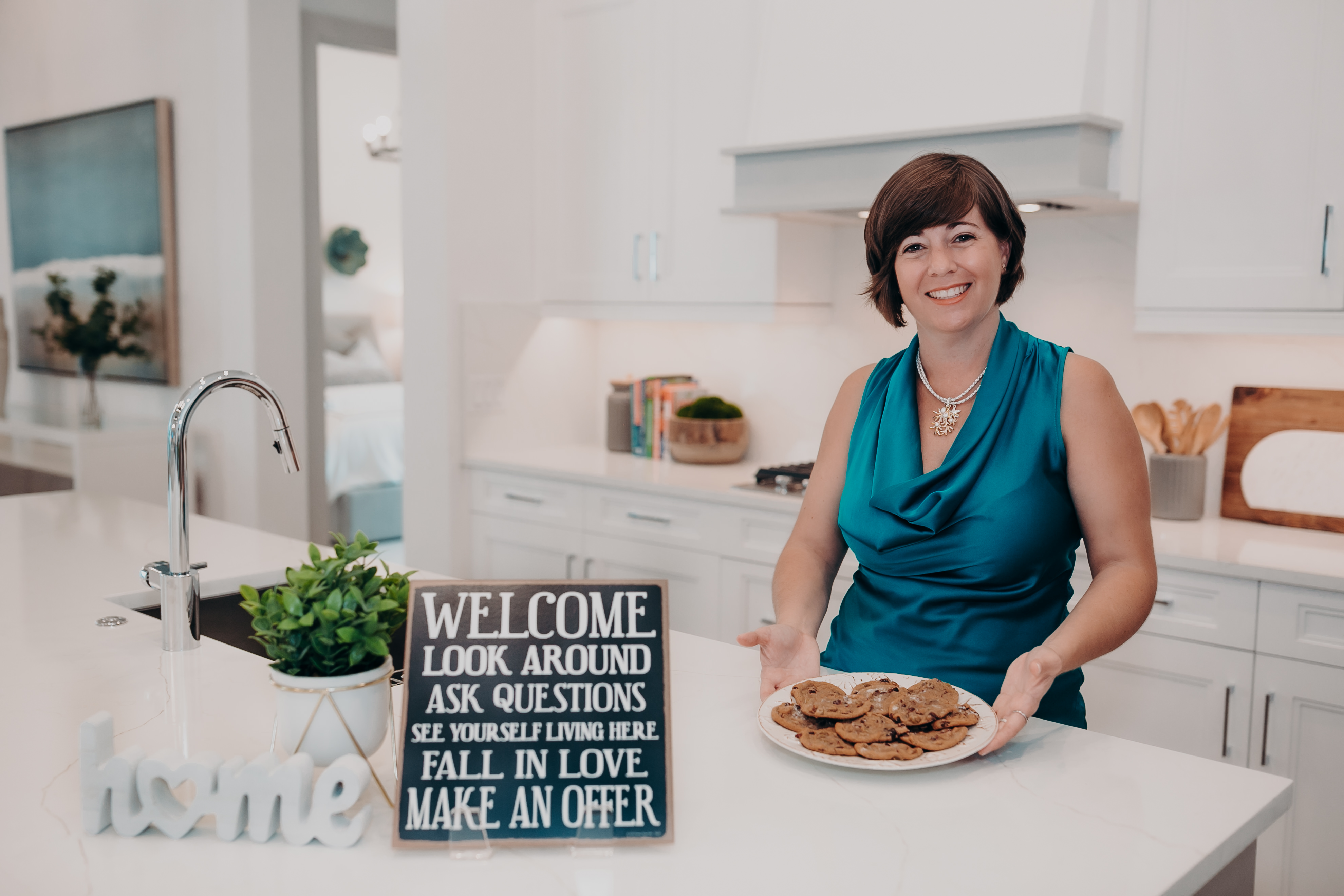 A woman sitting at a counter with a plate of food