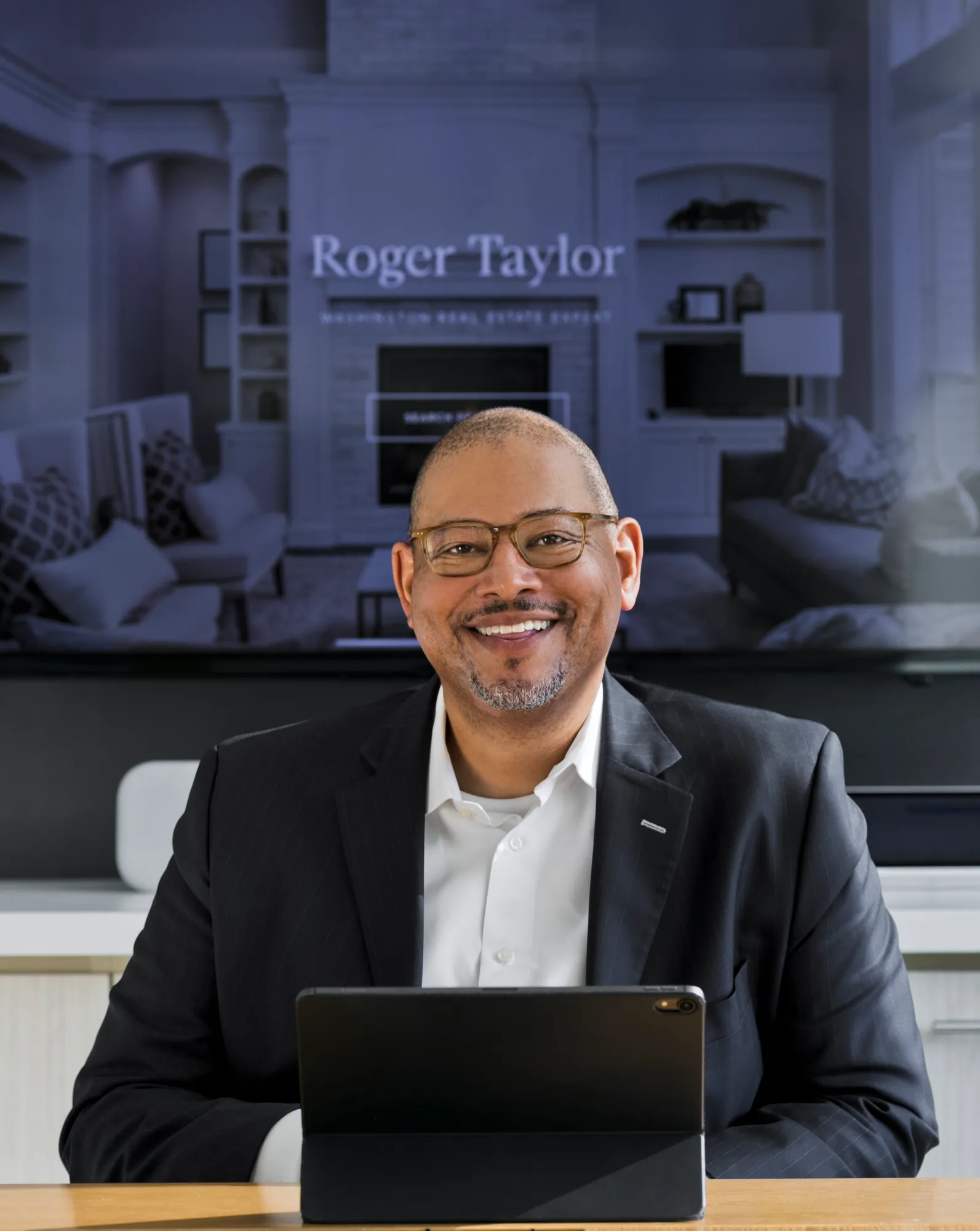 a man in a suit and tie sitting at a table