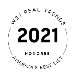 A logo from Real Trends