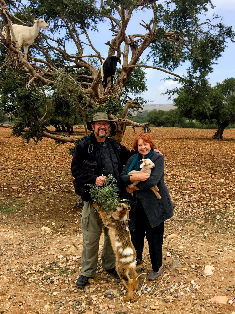 a man and a woman holding a small child