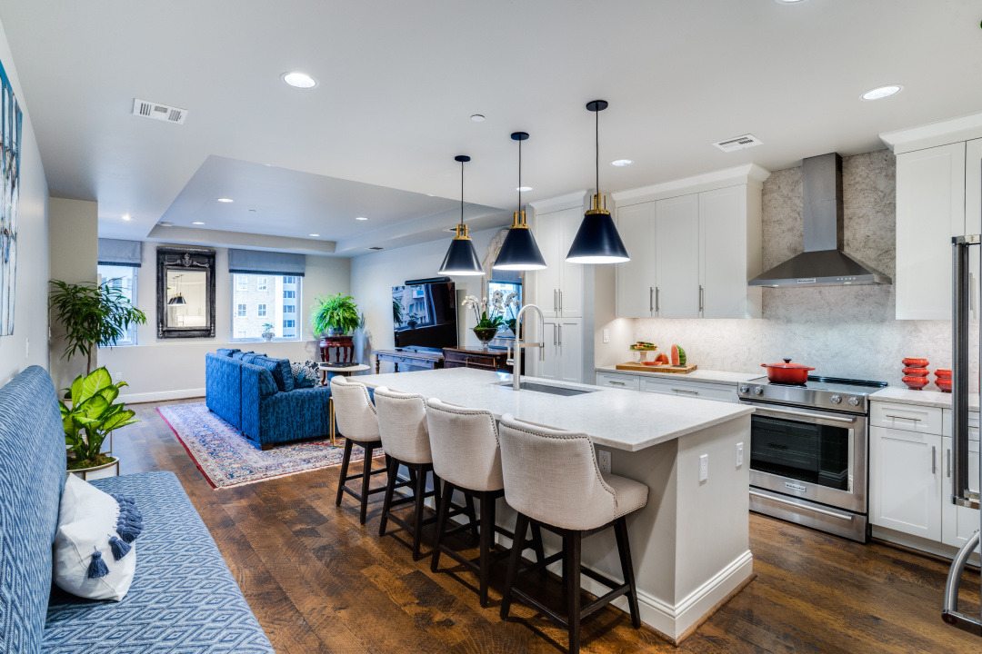 A kitchen with a table, chairs, and a stove