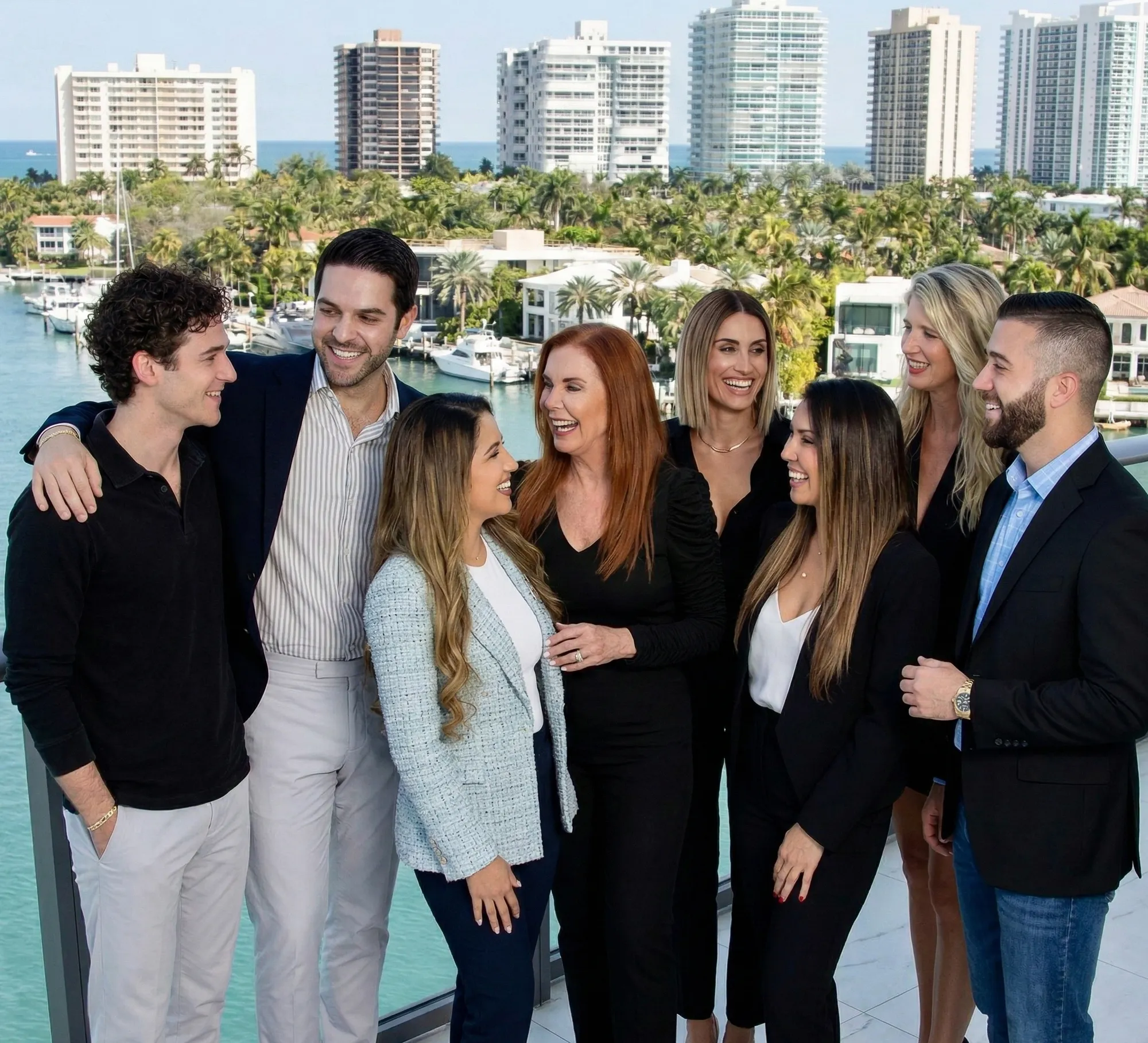Casanova Group pictured with Waterfront skyline in background. Pictured from left to right: Josh Kolkin, Renier Casanova, Sowj Suvarna, Monica Belizan, Jordana Quetgles, Liz Cox, Heloise Tapia, Jesus Gonzalez