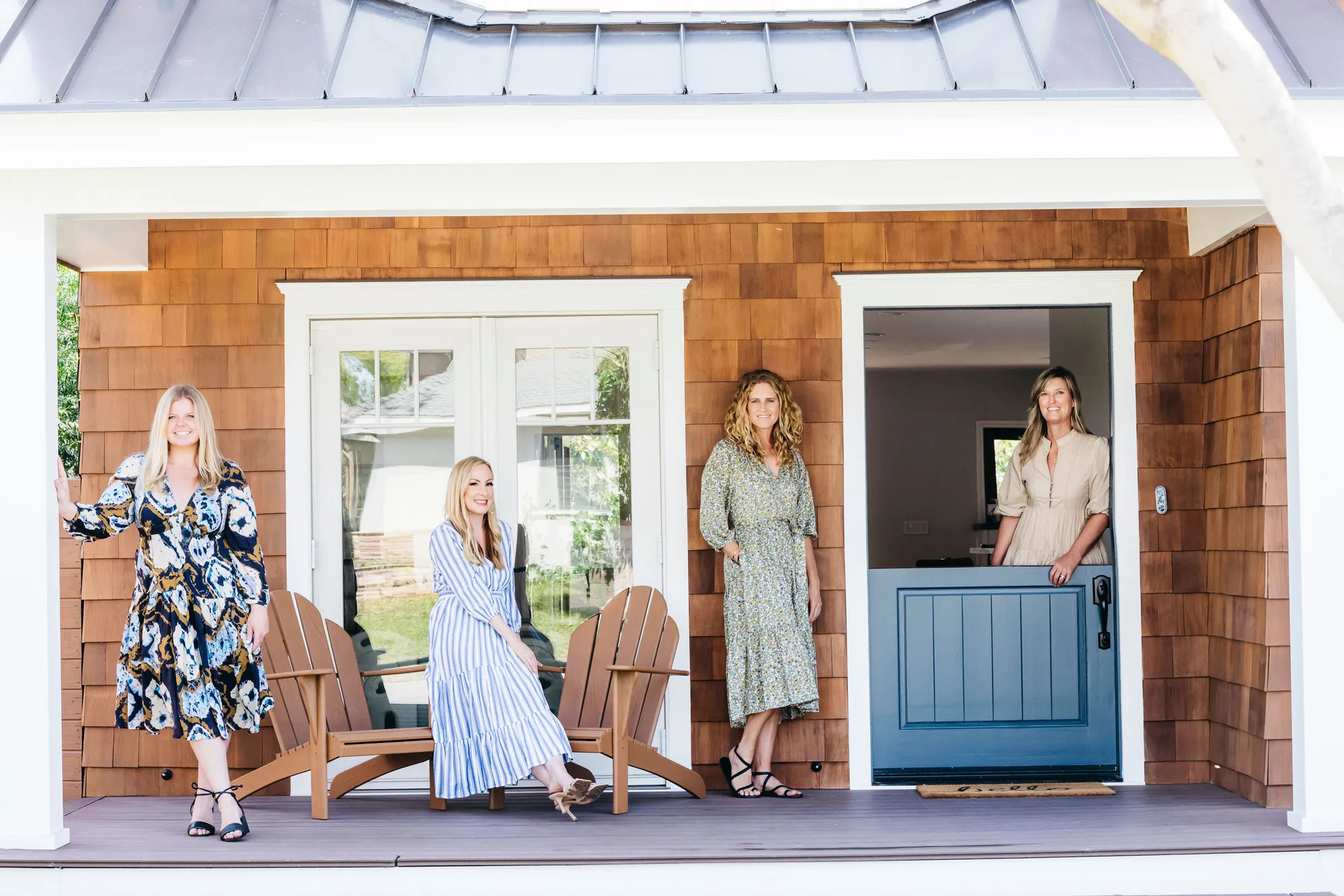 A woman and a man standing in front of a door