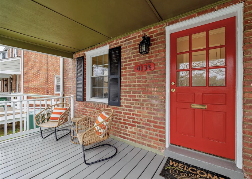 A patio with a bench and a chair