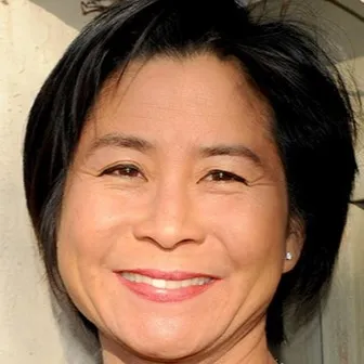 Nola Chow, Agent in  - Compass