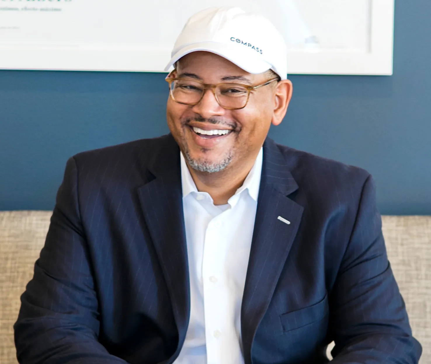 A man in a suit and tie smiling