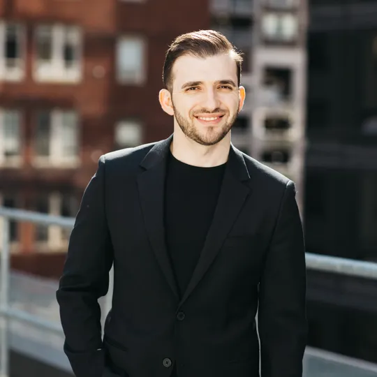 Eli Qarkaxhia, Agent in  - Compass