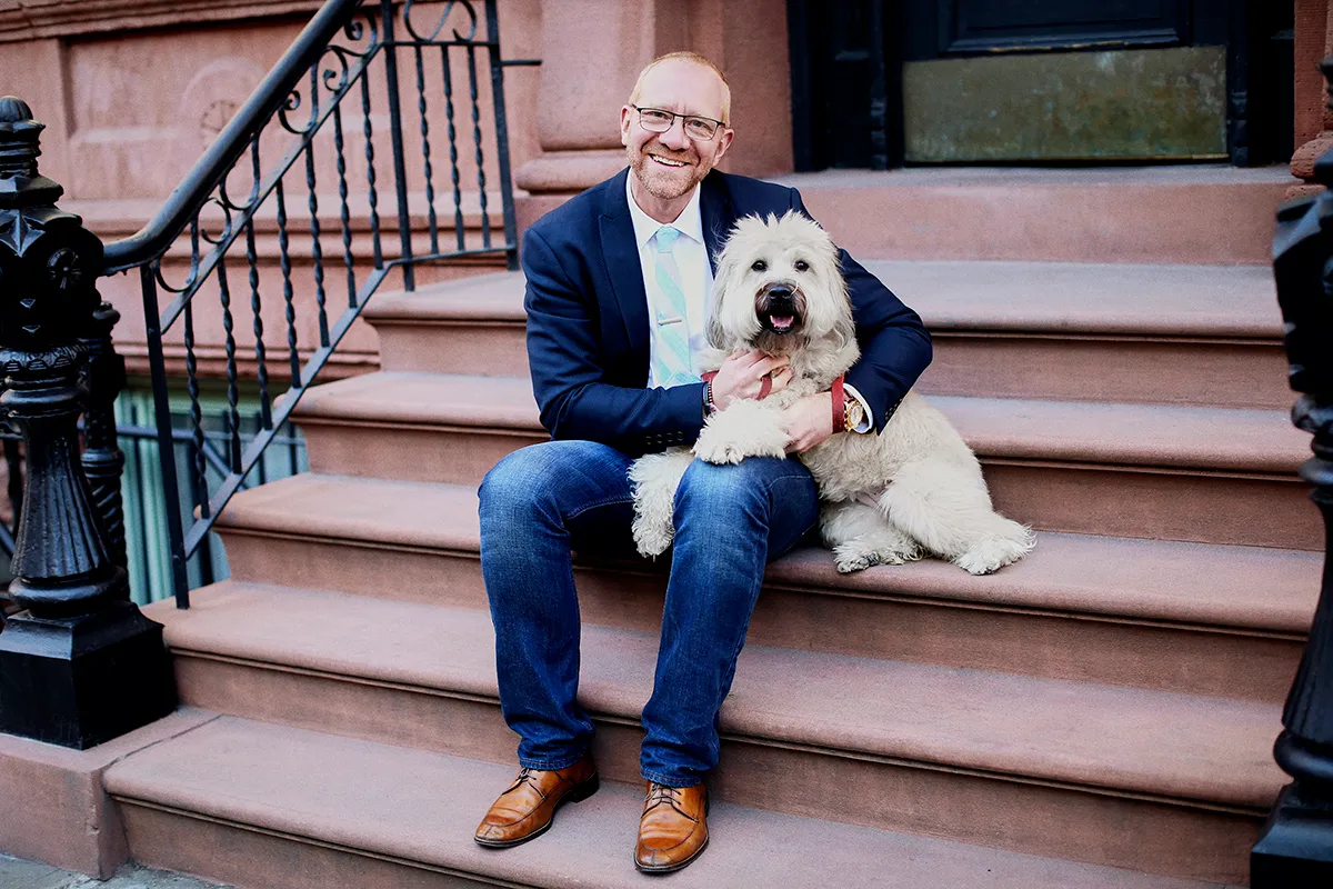 Man with dog on stoop