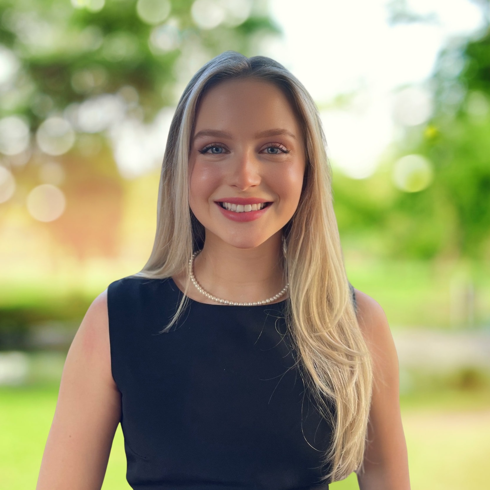 Headshot of Faith Sekel