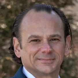 Lou Corti, Agent in  - Compass