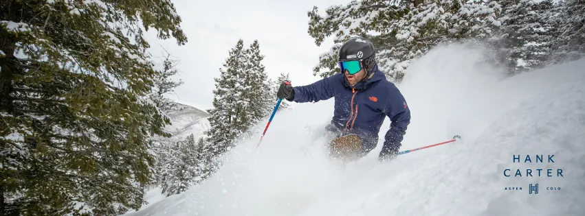 Man skiing in Aspen, Colorado with Hank Carter logo