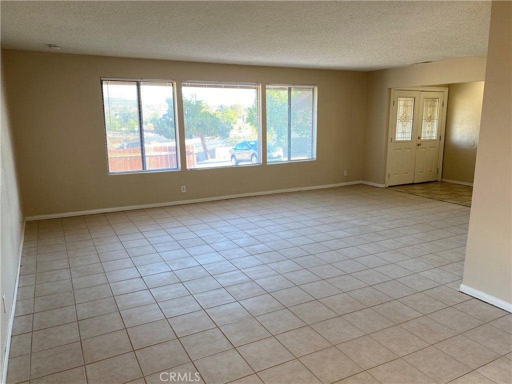 18746 Rock Springs Road Hesperia, CA 92345 - Photo 3 of 21 an empty room with windows