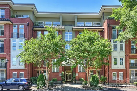a front view of a building with garden