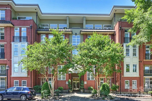 a front view of a building with garden