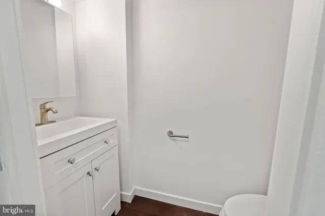 a bathroom with a sink and vanity