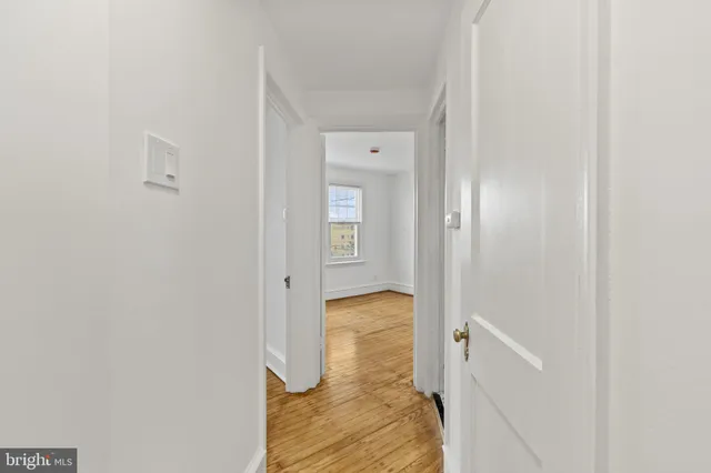 a view of a bathroom from a hallway