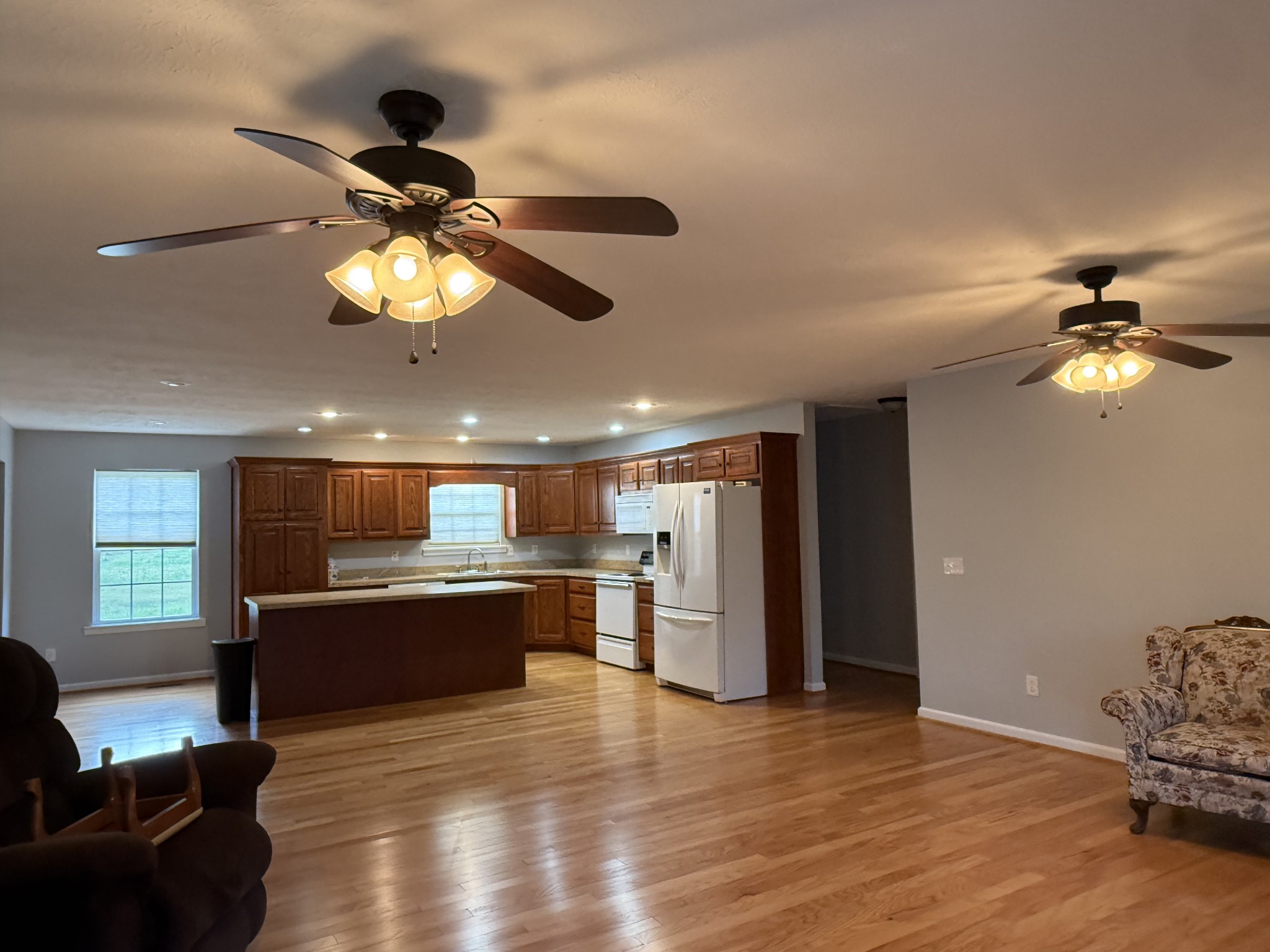 4205 Browning Branch Road Bethpage, TN 37022 - Photo 13 of 29 a view of a kitchen with a stove wooden floor and chandelier