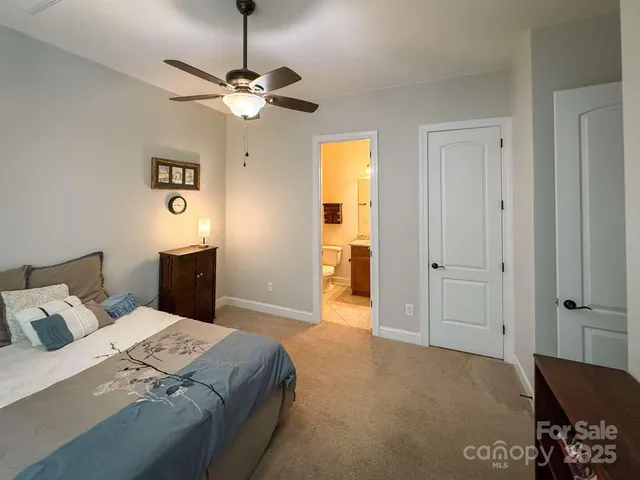 a bed room with a bed and a window