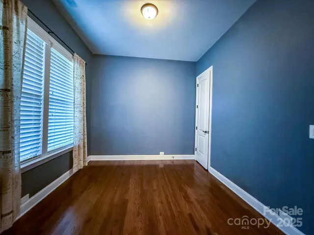 a kitchen with kitchen island a sink stainless steel appliances and cabinets