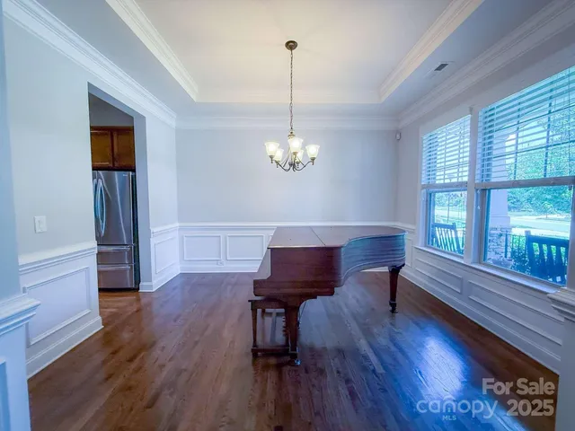 a kitchen with kitchen island granite countertop wooden cabinets a sink and dishwasher