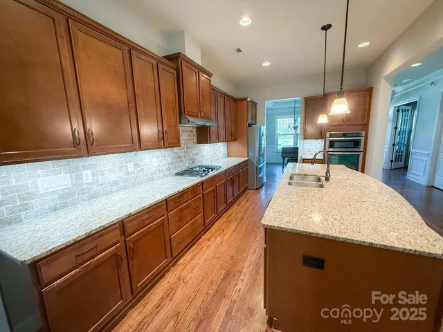a bedroom with a bed and a dresser next to a window