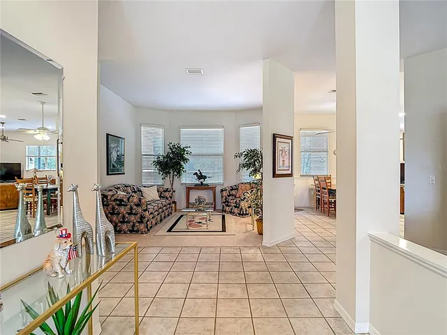 a kitchen with kitchen island granite countertop a stove a sink a oven and a refrigerator