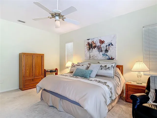 a view of a swimming pool with chair and table