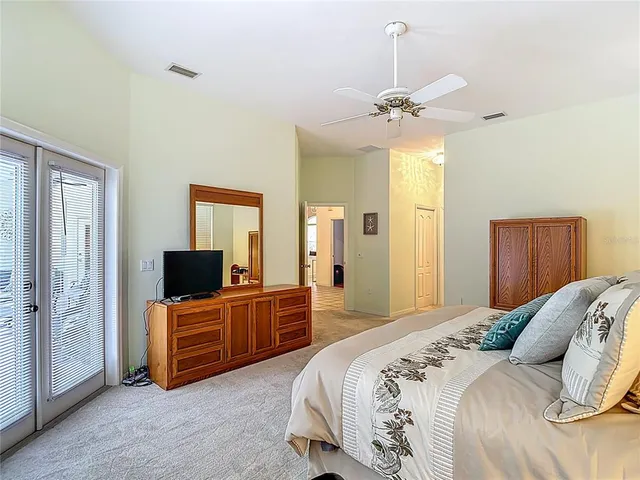 a swimming pool with outdoor seating yard and furniture