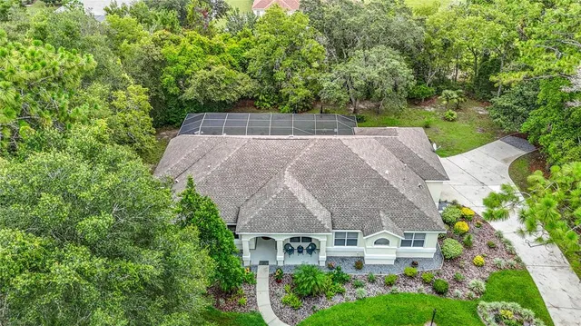a kitchen with granite countertop stainless steel appliances and white cabinets