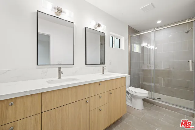 a view of a kitchen with sink and window