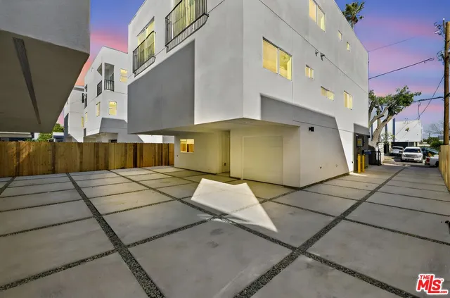 a view of kitchen and hall with wooden floor
