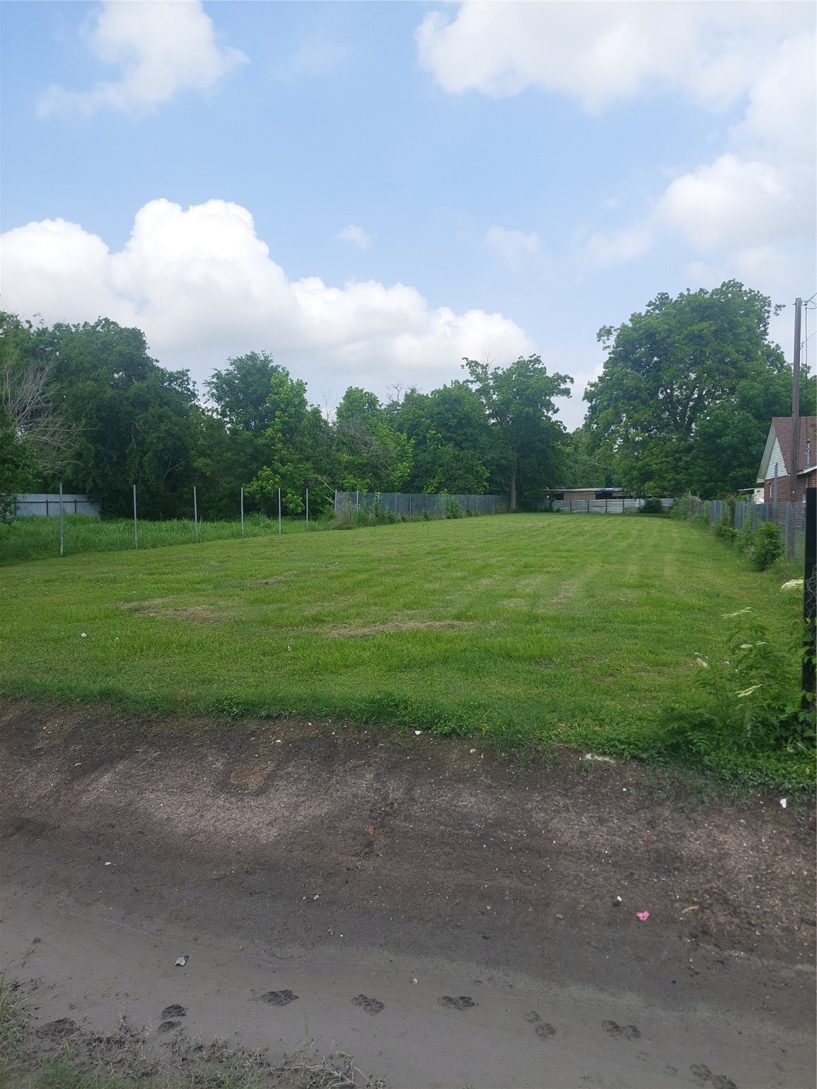 7330 Glass Street Houston, TX 77016 - Photo 3 of 4 a view of a field and trees in the background
