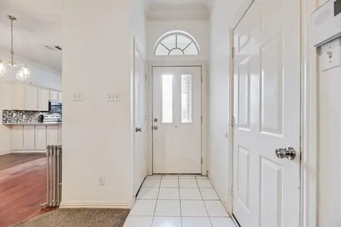 a view of a hallway with granite countertop a living room