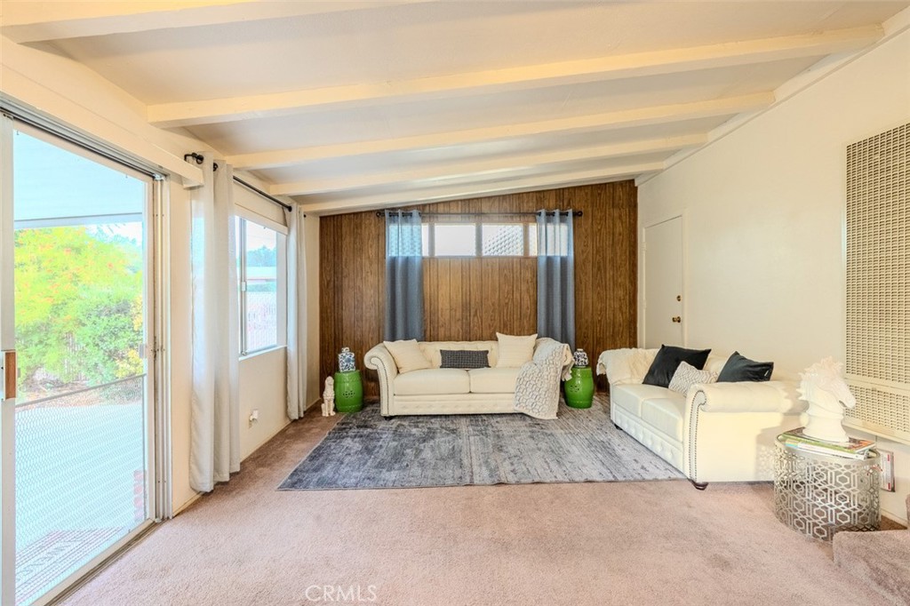 7859 Sycamore Avenue Riverside, CA 92504 - Photo 15 of 29 a living room with furniture and a large window