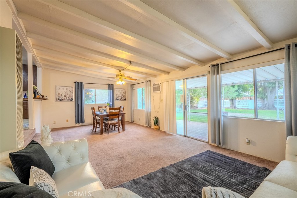 7859 Sycamore Avenue Riverside, CA 92504 - Photo 17 of 29 a living room filled with furniture and large windows