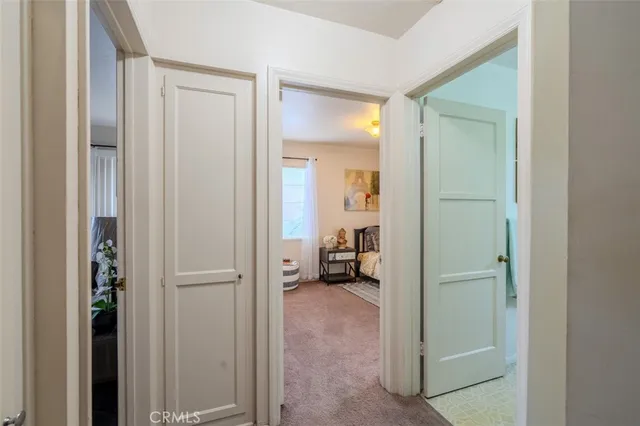 a view of a livingroom from a hallway