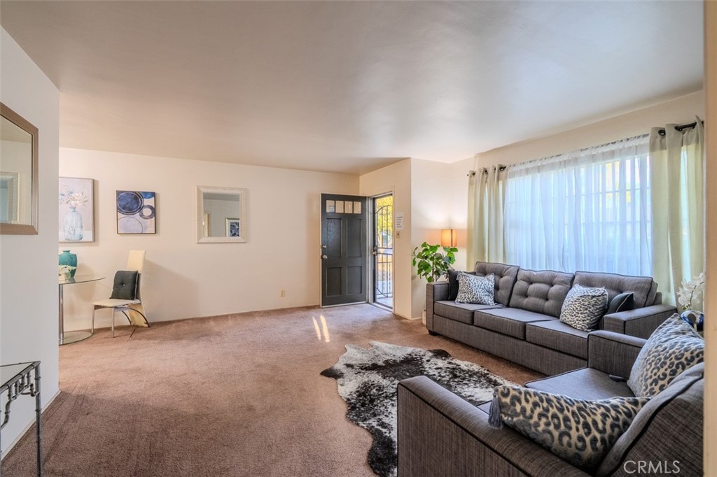 7859 Sycamore Avenue Riverside, CA 92504 - Photo 4 of 29 a living room with furniture and a window