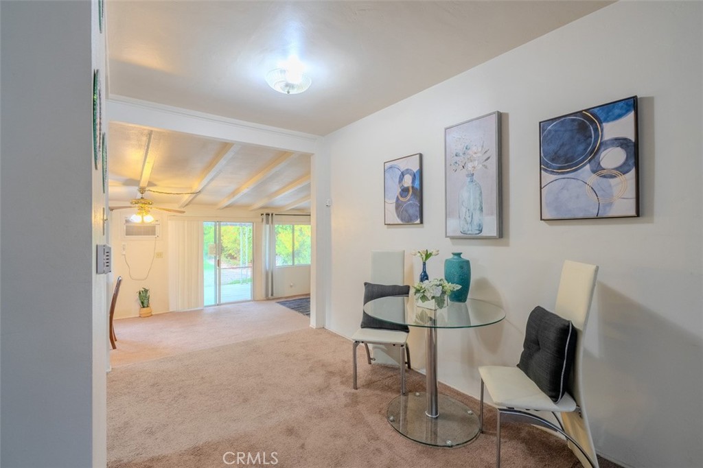 7859 Sycamore Avenue Riverside, CA 92504 - Photo 8 of 29 a living room with furniture and a large window