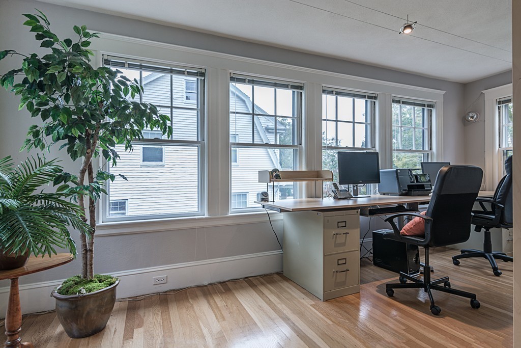 46 Allen Road Winchester, MA 01890 - Photo 8 of 29 a view of a workspace with furniture and a potted plant