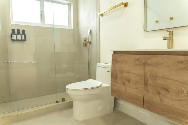a bathroom with a toilet and shower